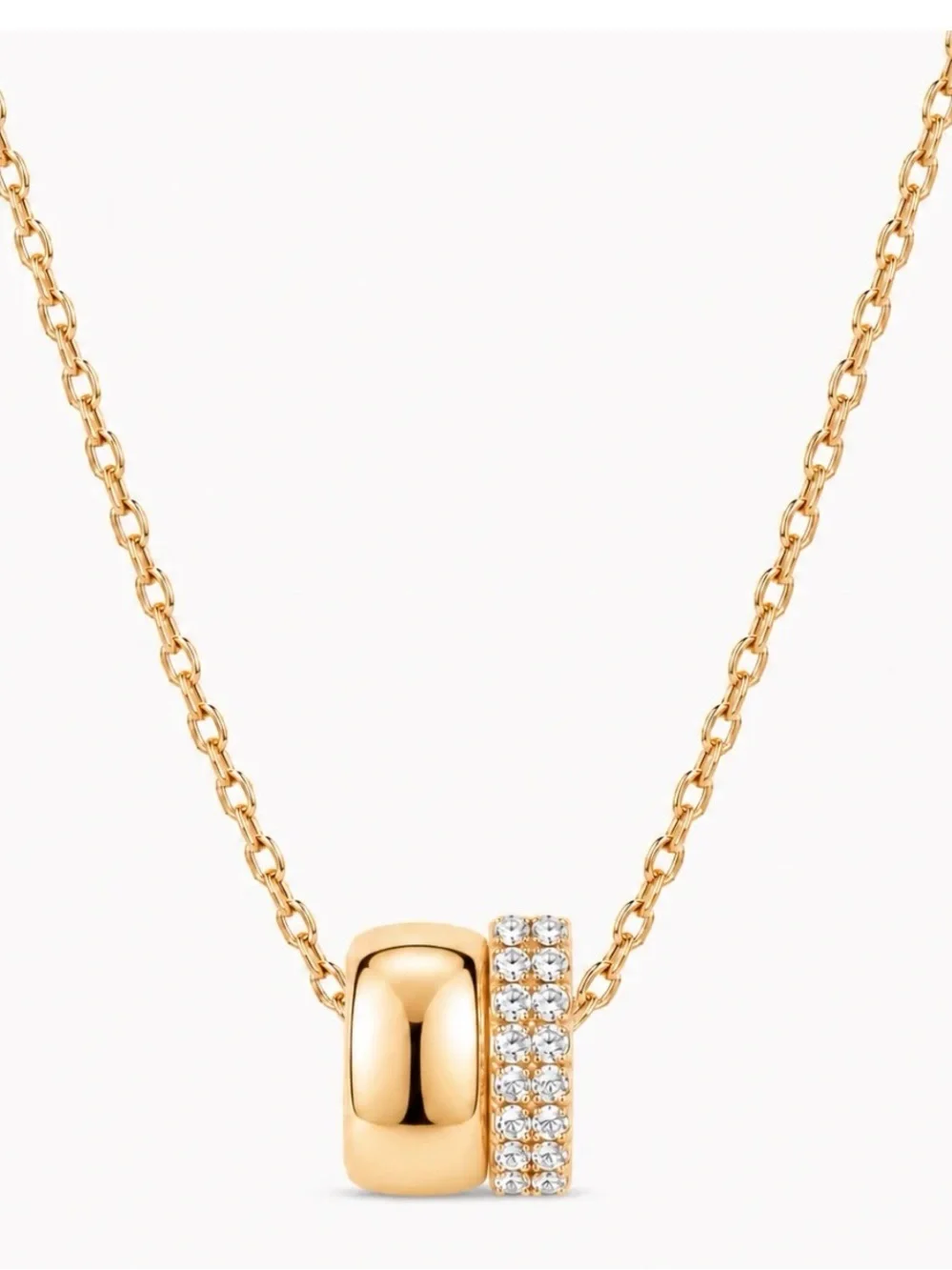 Elegant gold-tone pendant necklace featuring a pavé double ring design. NWT.